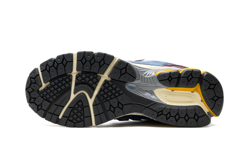 Lifestyle photo – New Balance 1906R Blue worn with denim jeans