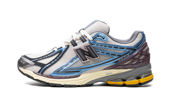 New Balance 1906R Blue sneaker – side profile view on white background