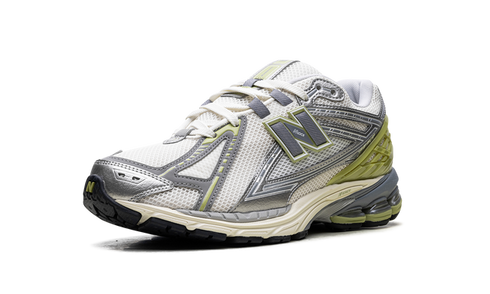 Close-up of New Balance 1906R sneaker details in Cactus Green