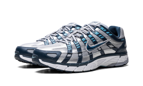 Nike P-6000 Armory Navy and Flat Silver sneaker with mesh and leather layers, available at ASEY SHOP Morocco.