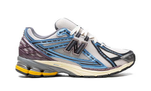 Pair of New Balance 1906R Blue sneakers – angled front display