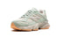 Limited-edition New Balance 9060 The Whitaker Group - Missing Pieces - Moss Green sneakers, available at ASEY SHOP Morocco.