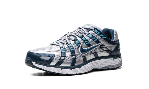 Nike P-6000 Armory Navy and Flat Silver sneaker with mesh and leather layers, available at ASEY SHOP Morocco.